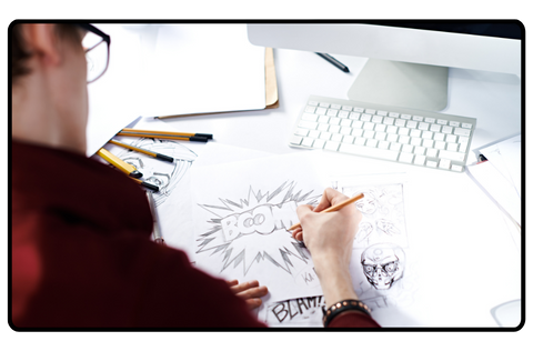 A man drawing a comic